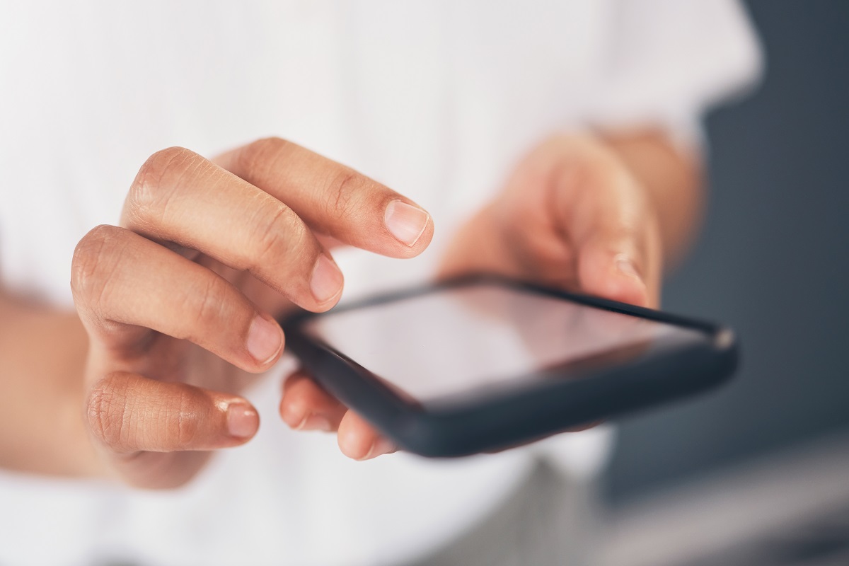 Closeup, hands and smartphone for typing, social media and connection for communication. Zoom, fema.